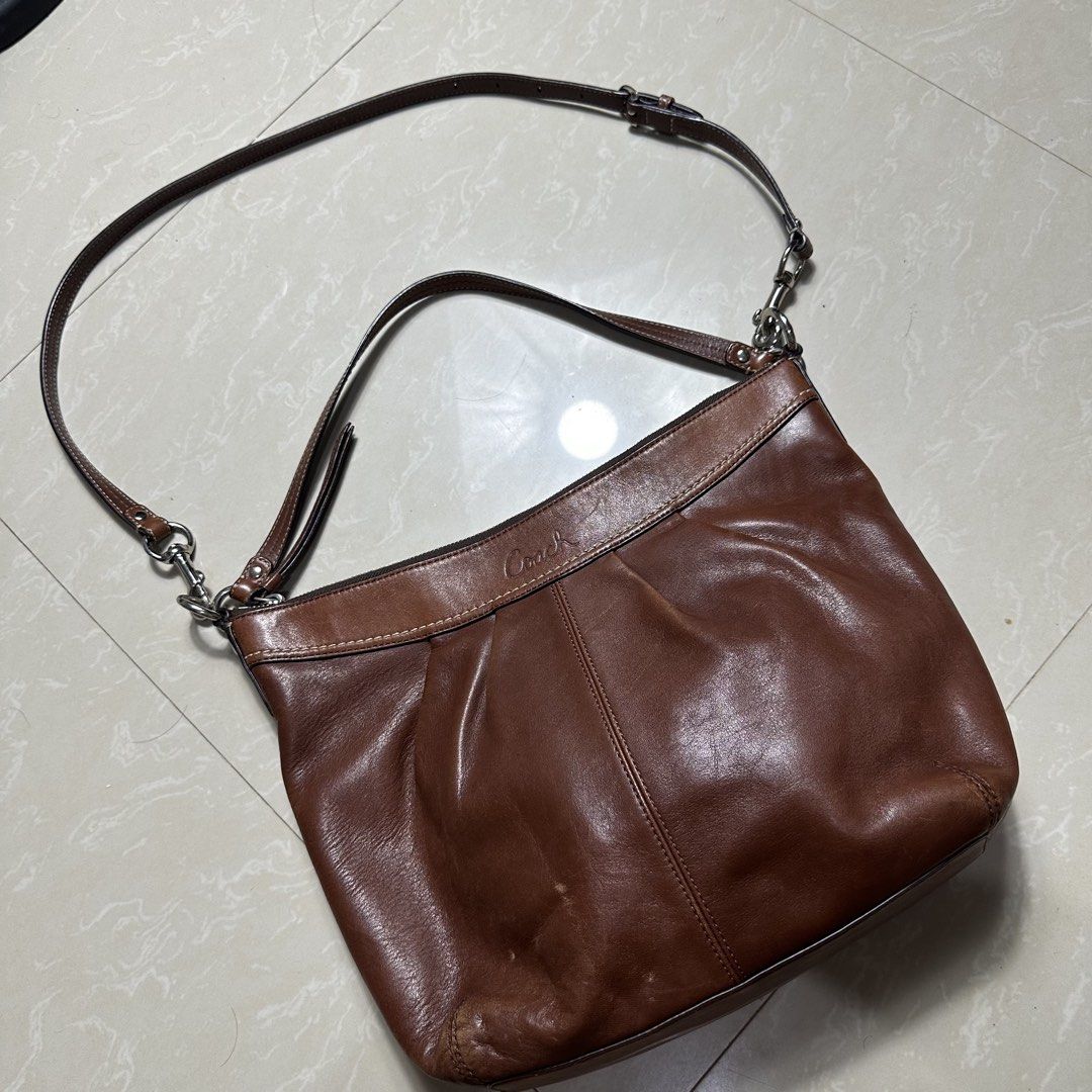 Coach Brown Leather Shoulder Bag with Adjustable Strap (Category: Luxury Bags & Wallets) located in Manila. Submitted by direcmampu37948 (Listing ID 1470245051, Image 1). Description: - Brand: Coach - Color: Classic Brown - Material: Premium Leather - Closure: Secure zip-top - Hardware: Silver-tone throughout - Design Features: Soft pleated front, structured base, and embossed logo near the top rim - Straps Included: Comes with both a short shoul