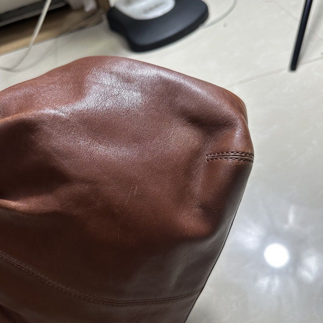 Coach Brown Leather Shoulder Bag with Adjustable Strap (Category: Luxury Bags & Wallets) located in Manila. Submitted by direcmampu37948 (Listing ID 1470245051, Image 3). Description: - Brand: Coach - Color: Classic Brown - Material: Premium Leather - Closure: Secure zip-top - Hardware: Silver-tone throughout - Design Features: Soft pleated front, structured base, and embossed logo near the top rim - Straps Included: Comes with both a short shoul