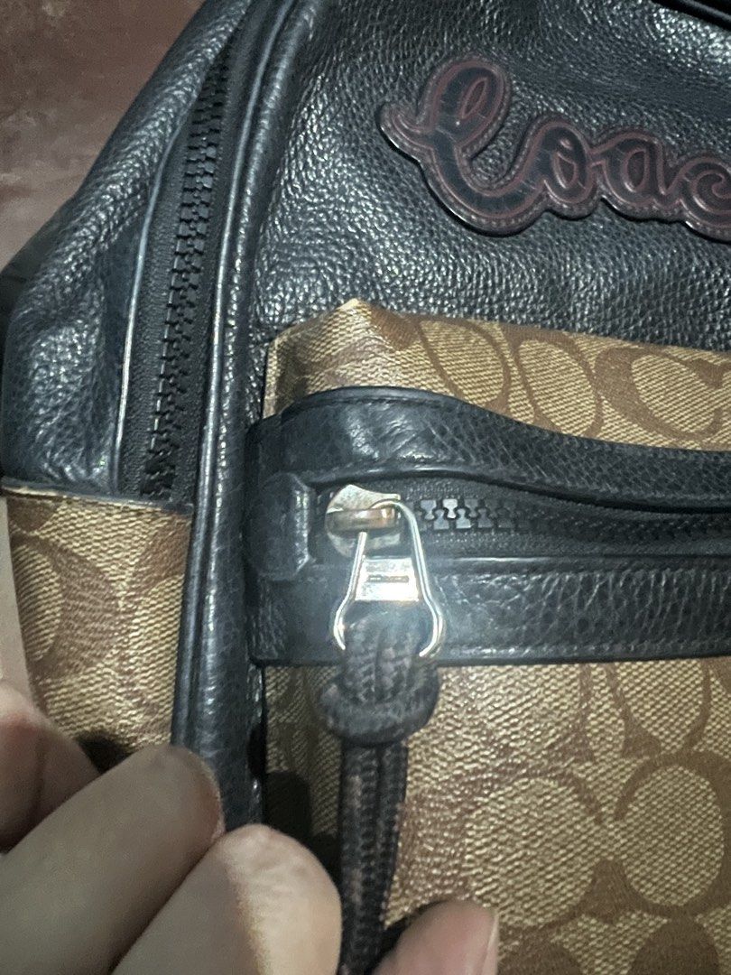Coach Charlie Signature Script Black Leather Backpack (Category: Backpacks) located in Caloocan City. Submitted by glamorouslysexy (Listing ID 1470174545, Image 2). Description: - Guaranteed Authentic Coach mini backpack - Material: Black pebble leather and signature canvas - Design: Large script Coach logo on the front upper section - Pockets: Front zip pocket with pull cords and pink leather tabs - Closure: Double zip top closure with matching 
