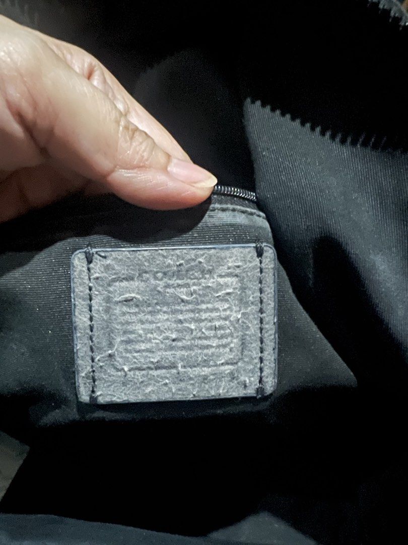 Coach Charlie Signature Script Black Leather Backpack (Category: Backpacks) located in Caloocan City. Submitted by glamorouslysexy (Listing ID 1470174545, Image 3). Description: - Guaranteed Authentic Coach mini backpack - Material: Black pebble leather and signature canvas - Design: Large script Coach logo on the front upper section - Pockets: Front zip pocket with pull cords and pink leather tabs - Closure: Double zip top closure with matching 