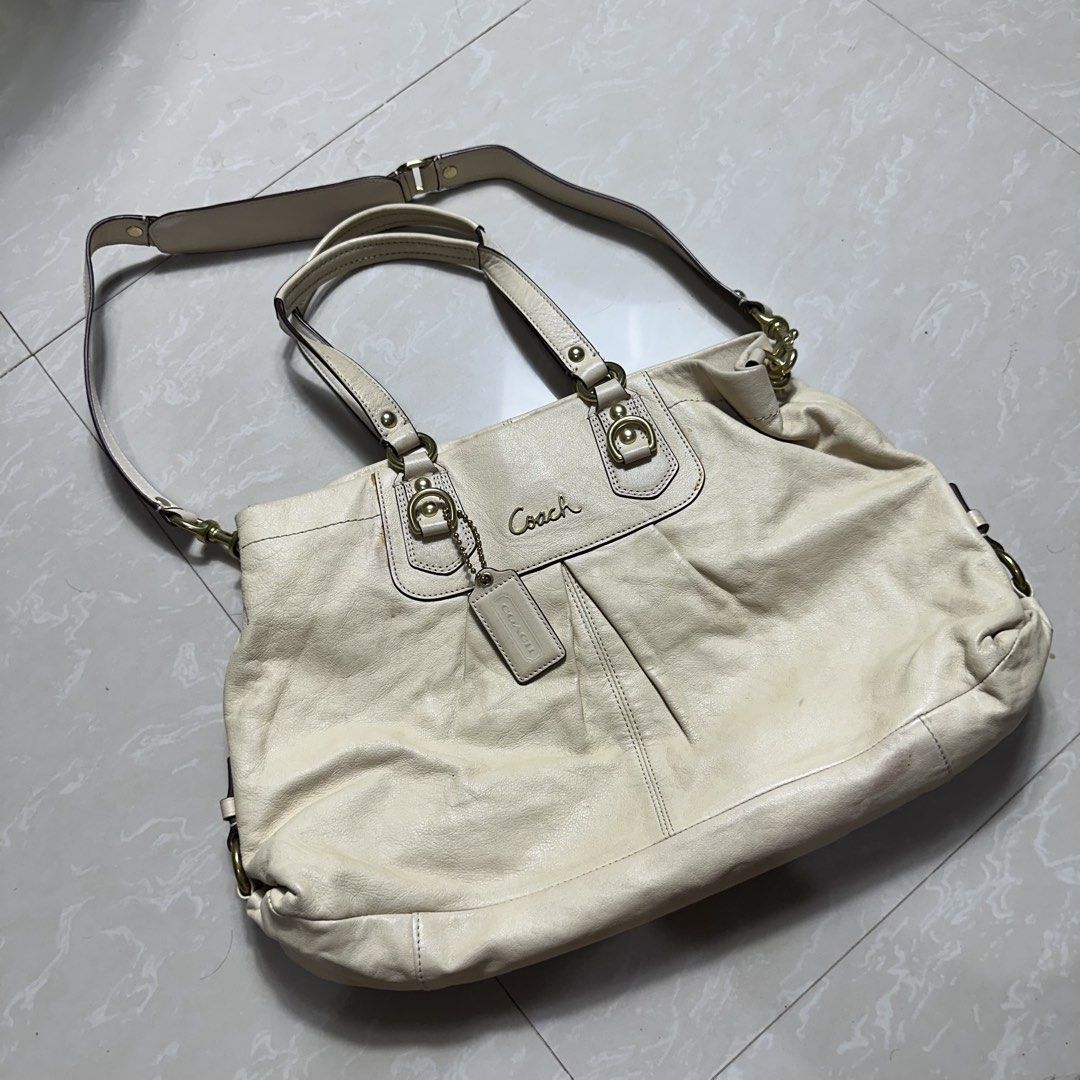 Coach Cream Leather Shoulder Bag (Category: Luxury Bags & Wallets) located in Manila. Submitted by direcmampu37948 (Listing ID 1470245001, Image 1). Description: - Brand: Coach - Material: Genuine leather in a versatile cream shade - Hardware: Gold-tone with metallic Coach logo lettering - Features: Double top handles, detachable shoulder strap, pleated front detail, and signature Coach hangtag - Condition: Pre-owned with minor discoloration and 