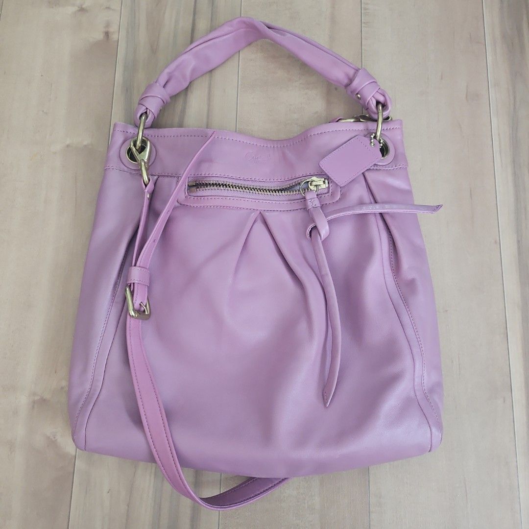 Coach Full-Grain Cowhide Leather Shoulder Bag Pink (Category: Luxury Bags & Wallets) located in Malabon City. Submitted by si.narcisa (Listing ID 1470235721, Image 1). Description: - Brand: Coach - Material: Full-grain cowhide leather in soft pink - Hardware: Brass-tone - Features: Front zip pocket, gathered pleat details, detachable shoulder strap, and matching hangtag - Interior: Light-colored fabric lining with creed patch (E1093-F13411) - Con