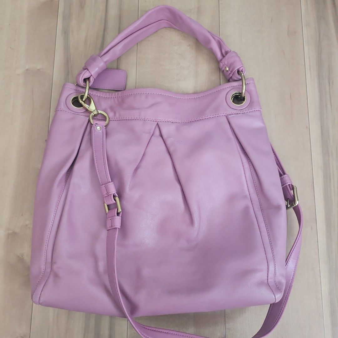Coach Full-Grain Cowhide Leather Shoulder Bag Pink (Category: Luxury Bags & Wallets) located in Malabon City. Submitted by si.narcisa (Listing ID 1470235721, Image 2). Description: - Brand: Coach - Material: Full-grain cowhide leather in soft pink - Hardware: Brass-tone - Features: Front zip pocket, gathered pleat details, detachable shoulder strap, and matching hangtag - Interior: Light-colored fabric lining with creed patch (E1093-F13411) - Con