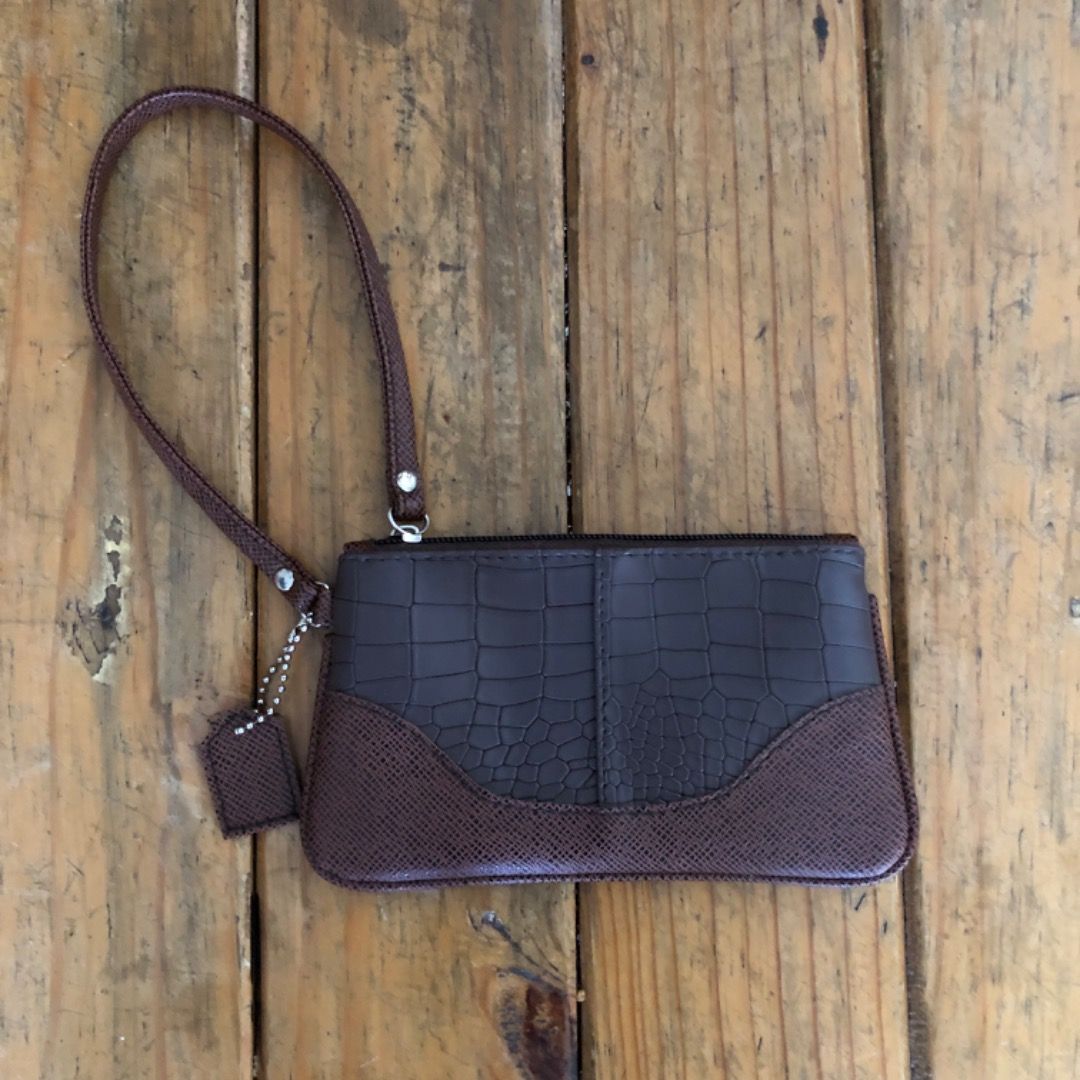 Coach inspired wristlet in choco brown (Category: Wallets & Card Holders) located in Bulacan. Submitted by _helpmedeclutterr (Listing ID 1470310067, Image 1). Description: Wristlet wallet.