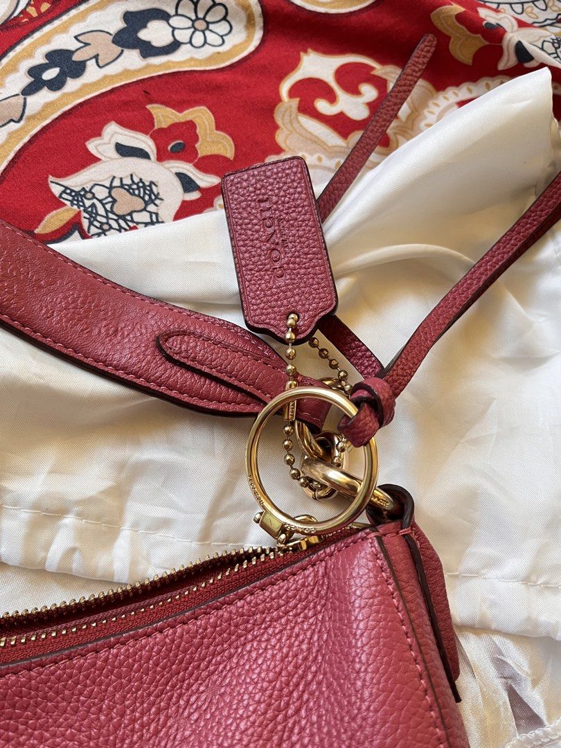 Coach Leather Hobo Shoulder Bag Pink (Category: Luxury Bags & Wallets) located in Masbate. Submitted by leylauren_16 (Listing ID 1470304525, Image 3). Description: -Kita issue pero keri ipa costumized paint -Ykk zip complete hangtag -hardware need i polish Coach leather hobo shoulder bag in a dusty pink shade. Gold-tone hardware and top zip closure. Matching leather hangtag and tassel charm included. Interior lined with pink fabric, featuring a s