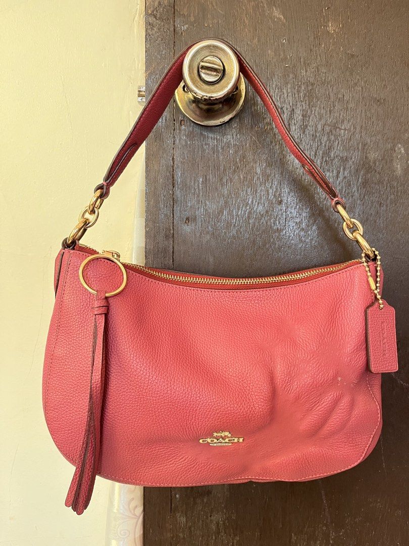 Coach Leather Hobo Shoulder Bag Pink (Category: Luxury Bags & Wallets) located in Masbate. Submitted by leylauren_16 (Listing ID 1470304525, Image 2). Description: -Kita issue pero keri ipa costumized paint -Ykk zip complete hangtag -hardware need i polish Coach leather hobo shoulder bag in a dusty pink shade. Gold-tone hardware and top zip closure. Matching leather hangtag and tassel charm included. Interior lined with pink fabric, featuring a s