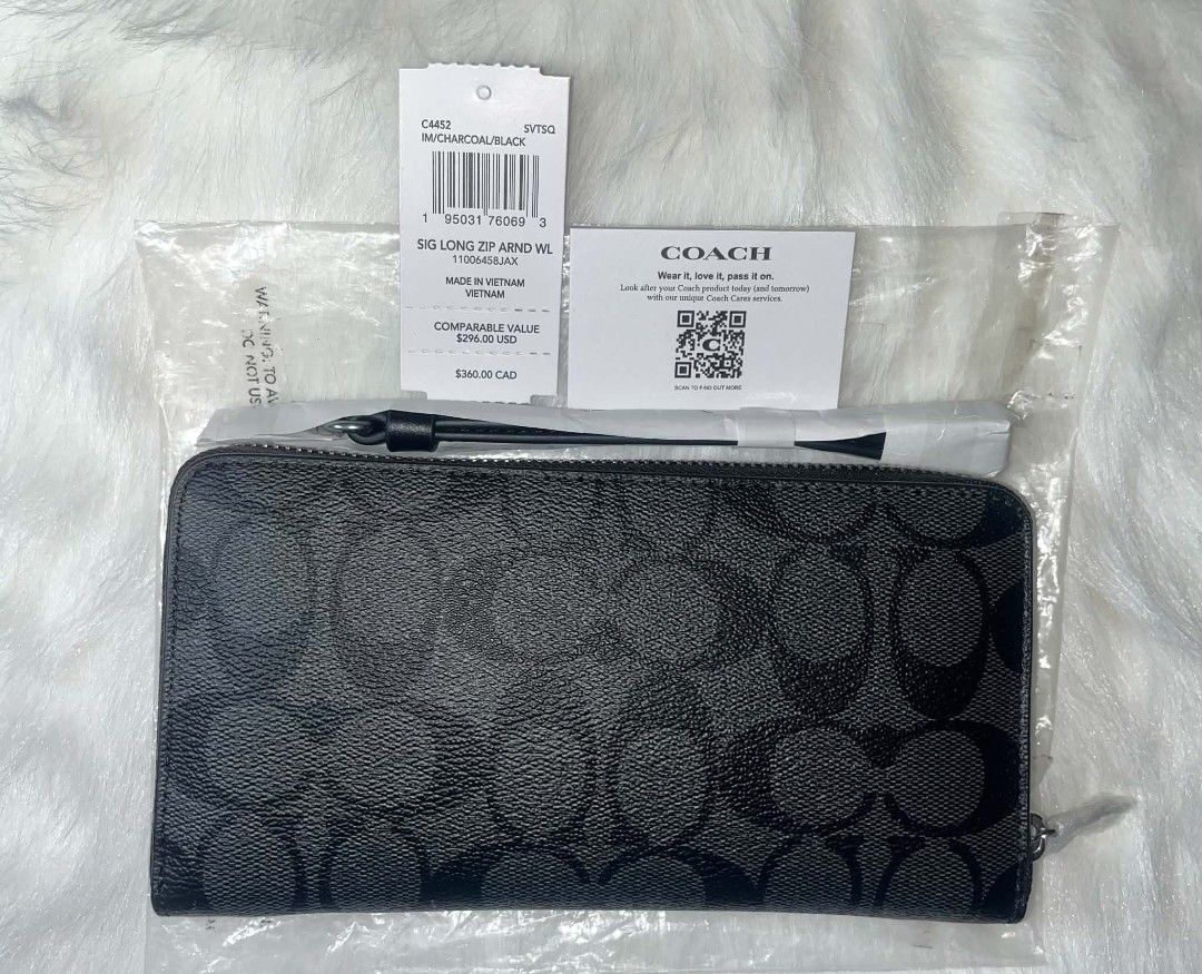 Coach Long Zip Around Wallet Black C4452 (Category: Wallets & Card holders) located in Imus. Submitted by maria_pilayo (Listing ID 1470227477, Image 3). Description: - 💯% Authentic Coach Long Zip Around Wallet - Charcoal and black signature coated canvas - Measures 19cm x 10cm - Includes detachable wrist strap, original tags, and care card - Features multiple card slots and a secure zippered coin compartment - All-around zip closure for safety.