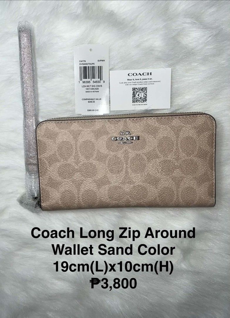 Coach Long Zip Around Wallet Sand Color (Category: Wallets & Card holders) located in Imus. Submitted by maria_pilayo (Listing ID 1470228272, Image 1). Description: - Brand: Coach Long Zip Around Wallet - 💯% Authentic - Color/Design: Sand and Taupe Signature Canvas - Dimensions: 19cm x 10cm - Interior: Multiple card slots and compartments - Inclusions: Detachable wrist strap (wrapped in plastic), original store tags, care card, and packaging - C