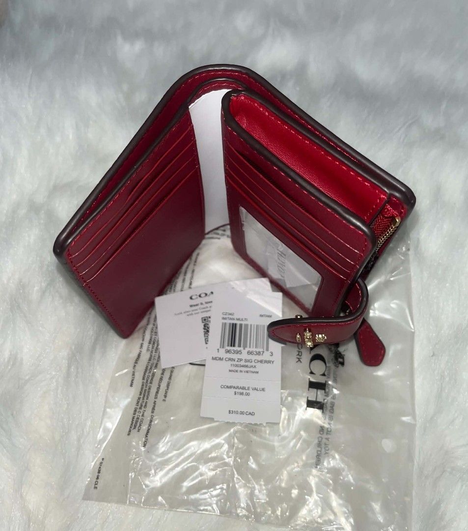 Coach Medium Corner Zip Signature Cherry Wallet IM/TAN MULTI (Category: Wallets & Card holders) located in Imus. Submitted by maria_pilayo (Listing ID 1470276385, Image 3). Description: - Coach - Brand new, never used, and stored in plastic packaging - 💯% Authentic Coach medium corner zip wallet in signature canvas with cherry print - Features rich red leather trim and gold-tone hardware - Compact size: 13cm x 9cm - Interior includes multiple ca