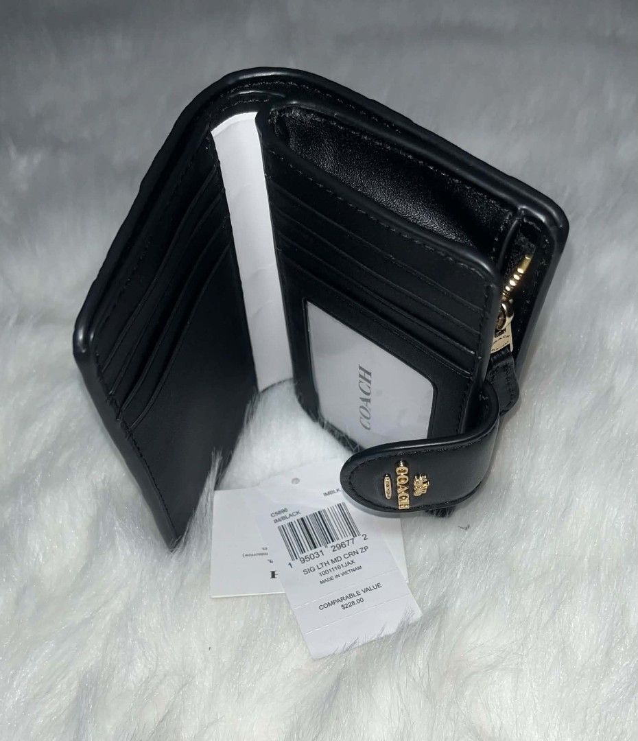 Coach Medium Corner Zip Wallet Black (Category: Wallets & Card holders) located in Imus. Submitted by maria_pilayo (Listing ID 1470279572, Image 3). Description: - Brand: Coach Medium corner zip wallet - 💯% Authentic - Color: Black with signature debossed pattern - Material: Leather with gold-tone hardware - Closure: Snap closure - Features: Multiple card slots, clear ID window, and zip coin pocket - Condition: Brand new with tags and care card 