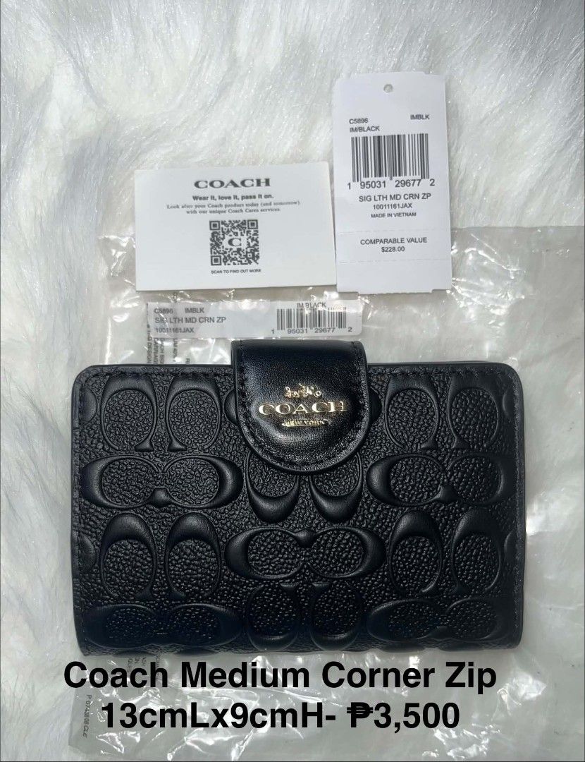 Coach Medium Corner Zip Wallet Black (Category: Wallets & Card holders) located in Imus. Submitted by maria_pilayo (Listing ID 1470279572, Image 1). Description: - Brand: Coach Medium corner zip wallet - 💯% Authentic - Color: Black with signature debossed pattern - Material: Leather with gold-tone hardware - Closure: Snap closure - Features: Multiple card slots, clear ID window, and zip coin pocket - Condition: Brand new with tags and care card 