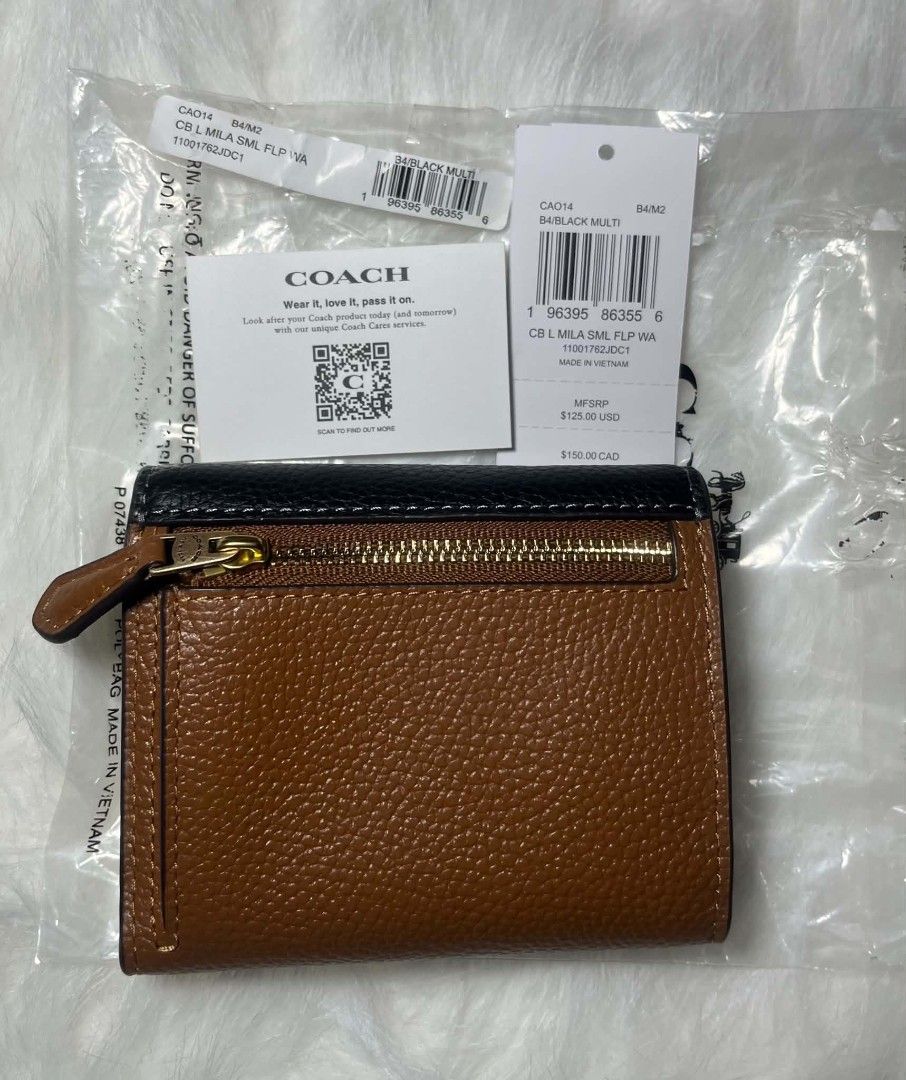 Coach Mila Small Flap Trifold Wallet Black Multi (Category: Luxury Bags & Wallets) located in Imus. Submitted by maria_pilayo (Listing ID 1470221969, Image 3). Description: - Brand: Coach - Style: 💯% Authentic Trifold wallet - Colorway: Black Multi - Dimensions: 11cm x 9.5cm - Features: Multiple card slots, cash compartments, and convenient exterior zip pocket for coins - Condition: Brand new, still in protective plastic packaging - Inclusions: 