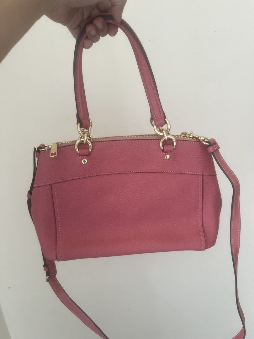Coach Mini Brooke Carryall (Category: Luxury Bags & Wallets) located in Bulacan. Submitted by jhemieee (Listing ID 1470187369, Image 2). Description: - Brand: Coach - Material: Premium pink Saffiano leather - Hardware: Elegant gold-tone - Closure: Secure zip-top - Interior: Lined with multiple compartments - Carry Options: Double top handles and adjustable/detachable shoulder strap - Includes: Matching Coach leather hangtag - Condition: Clean, st
