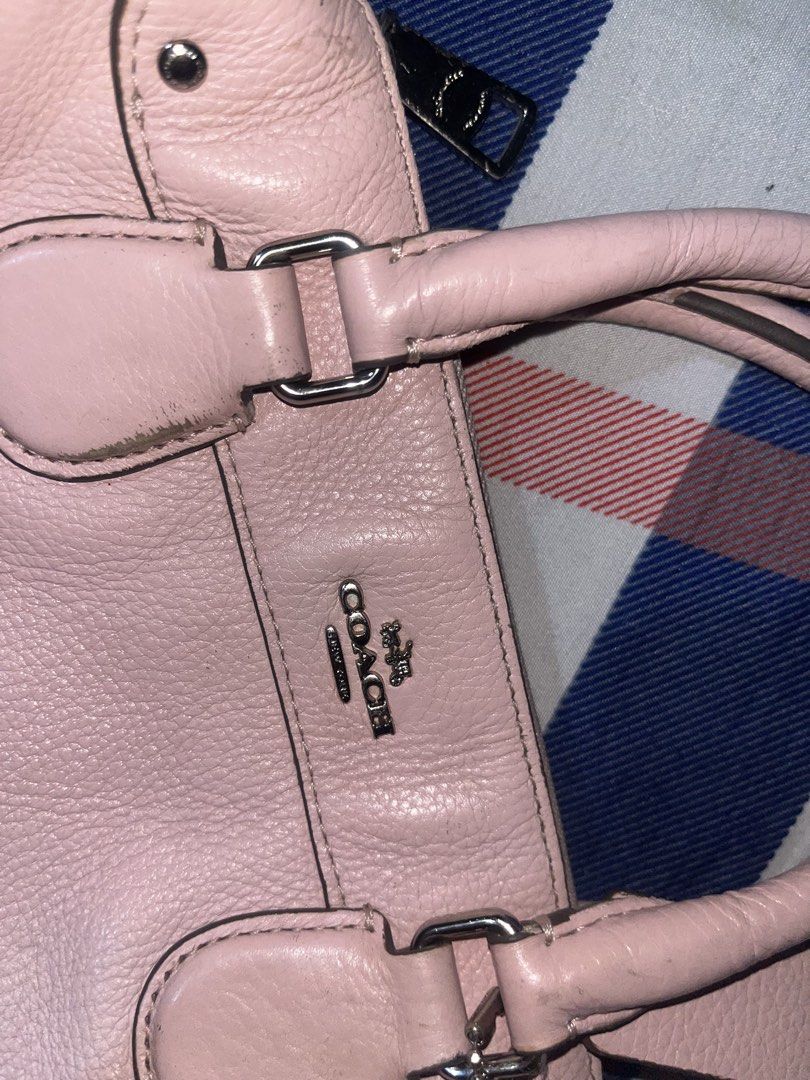 Coach Pink Leather Handbag Satchel (Category: Luxury Bags & Wallets) located in Manila. Submitted by nagbebentabumibili (Listing ID 1470336137, Image 3). Description: - Authentic Coach handbag in soft pink pebbled leather - Silver-tone hardware with matching Coach hangtag - Secure zip closure with double top handles - Pink fabric-lined interior featuring a zip pocket and slip pocket - Includes official Coach creed patch inside - Flaws: Minor scuf