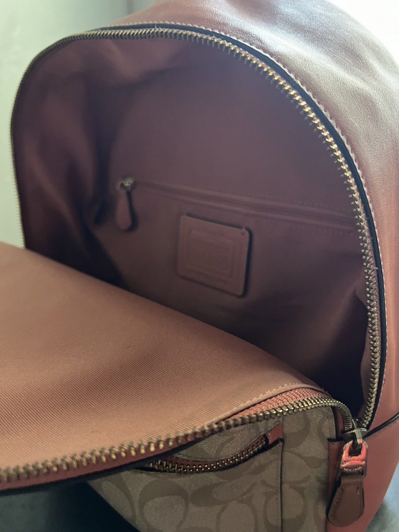 Coach Rainbow Signature Canvas Backpack (Category: Backpacks) located in Manila. Submitted by mrgixy (Listing ID 1470206681, Image 2). Description: COACH Rainbow Signature Canvas Backpack Selling Price: ₱4,500 (negotiable) Coach Style: F72846 Signature Canvas with Rainbow Motif Beige/Kahki with Coral Pink Details Condition: Like New No Peeling, stains, discoloration, or zipper issues Inclusion: Bag Only No receipt, dust bag, or original tags RFS: