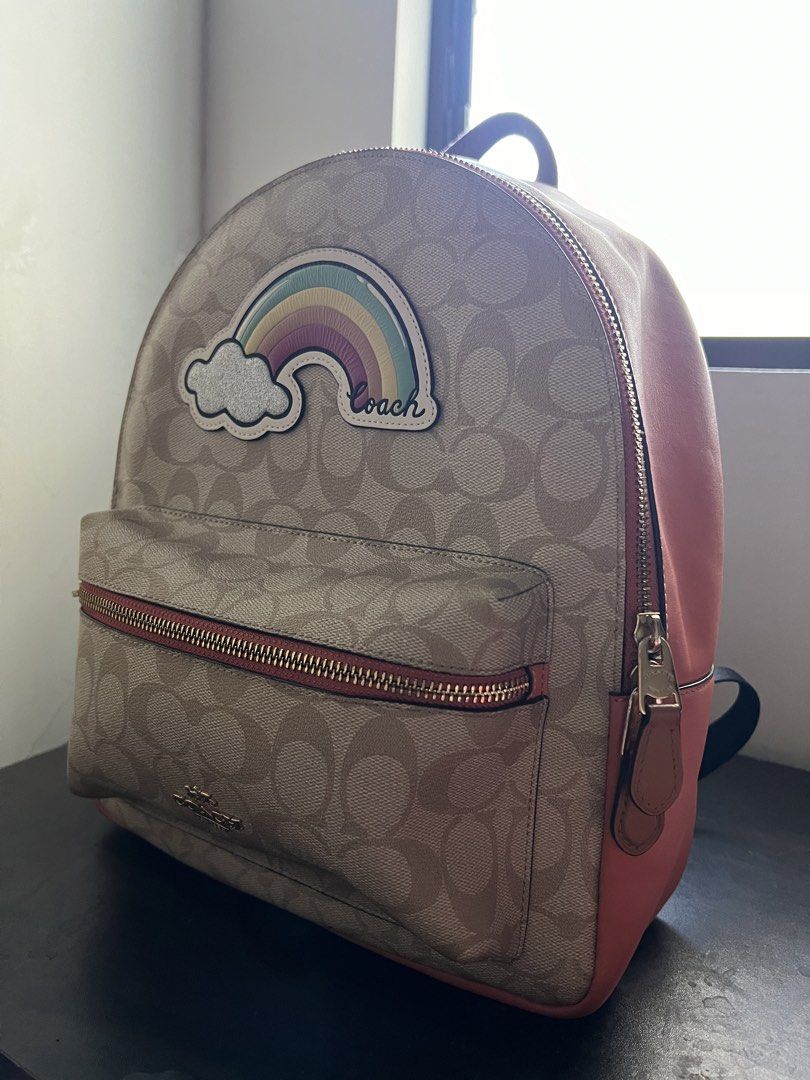 Coach Rainbow Signature Canvas Backpack (Category: Backpacks) located in Manila. Submitted by mrgixy (Listing ID 1470206681, Image 1). Description: COACH Rainbow Signature Canvas Backpack Selling Price: ₱4,500 (negotiable) Coach Style: F72846 Signature Canvas with Rainbow Motif Beige/Kahki with Coral Pink Details Condition: Like New No Peeling, stains, discoloration, or zipper issues Inclusion: Bag Only No receipt, dust bag, or original tags RFS: