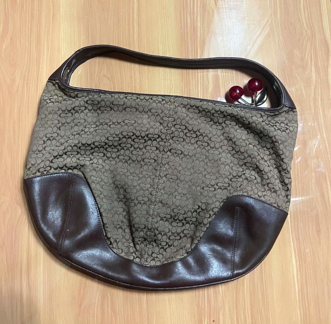 Coach Signature Brown Ergo Bag (Category: Shoulder Bags) located in Manila. Submitted by senggggg. (Listing ID 1470263440, Image 3). Description: good condition working zip minimal sign of use .