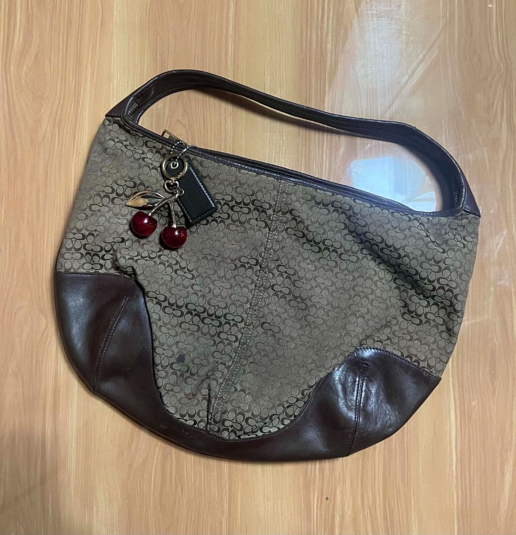 Coach Signature Brown Ergo Bag (Category: Shoulder Bags) located in Manila. Submitted by senggggg. (Listing ID 1470263440, Image 2). Description: good condition working zip minimal sign of use .