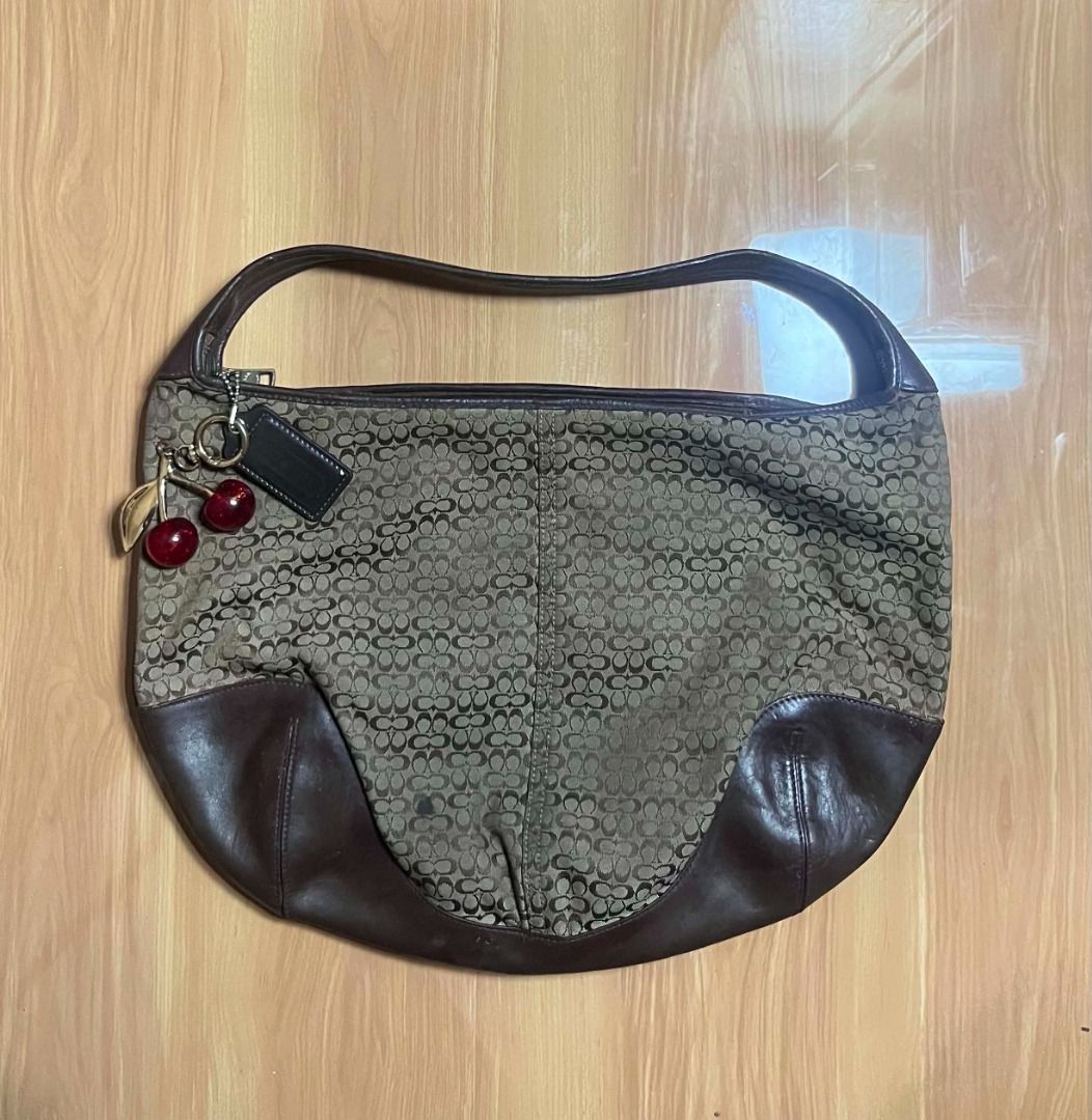 Coach Signature Brown Ergo Bag (Category: Shoulder Bags) located in Manila. Submitted by senggggg. (Listing ID 1470263440, Image 1). Description: good condition working zip minimal sign of use .