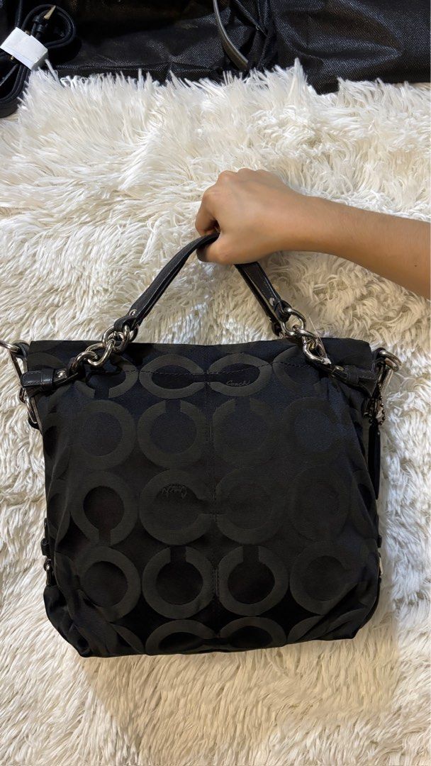 Coach Signature C Black Shoulder Bag (Category: Luxury Bags & Wallets) located in Rizal. Submitted by kianapreloves (Listing ID 1470208867, Image 2). Description: - Authentic Coach black shoulder bag with iconic signature C nylon fabric - Stylish silver hardware and genuine leather trim with matching leather hangtag - Chic double straps featuring trendy chain link details - Adjustable shape with convenient side snap closures - Spacious main compa