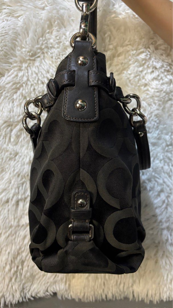 Coach Signature C Black Shoulder Bag (Category: Luxury Bags & Wallets) located in Rizal. Submitted by kianapreloves (Listing ID 1470208867, Image 3). Description: - Authentic Coach black shoulder bag with iconic signature C nylon fabric - Stylish silver hardware and genuine leather trim with matching leather hangtag - Chic double straps featuring trendy chain link details - Adjustable shape with convenient side snap closures - Spacious main compa