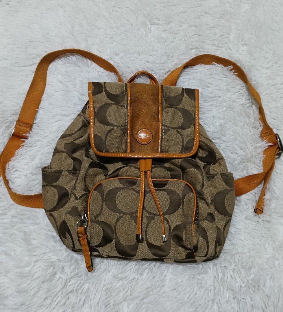 Coach Signature C Brown Orange Canvas Backpack (Category: Backpacks) located in Quezon City. Submitted by jdwoah12 (Listing ID 1470185235, Image 1). Description: - CONDITION: 8/10 EXCELLENT - ISSUE: SEND KOPO THRU PM.