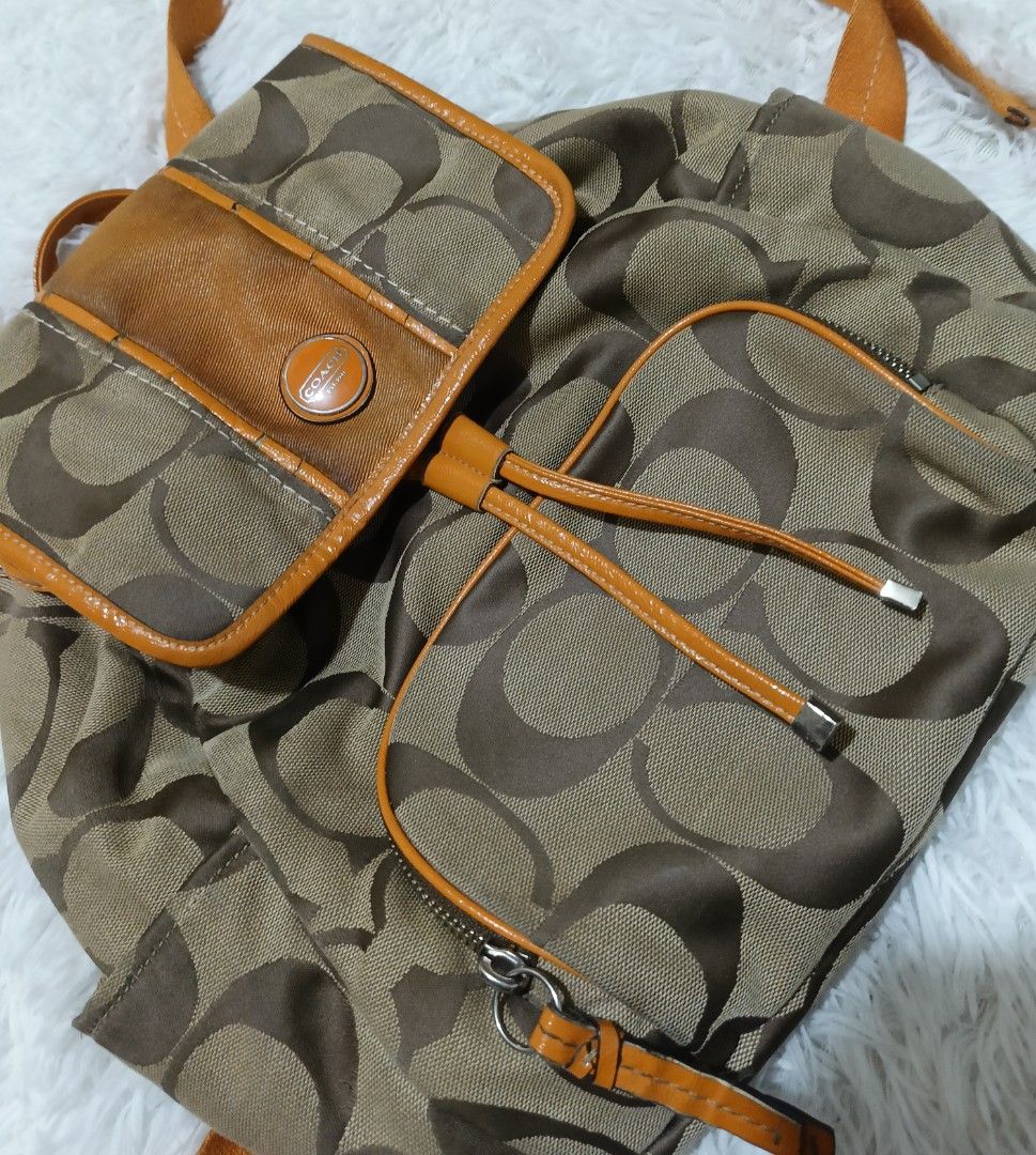 Coach Signature C Brown Orange Canvas Backpack (Category: Backpacks) located in Quezon City. Submitted by jdwoah12 (Listing ID 1470185235, Image 2). Description: - CONDITION: 8/10 EXCELLENT - ISSUE: SEND KOPO THRU PM.