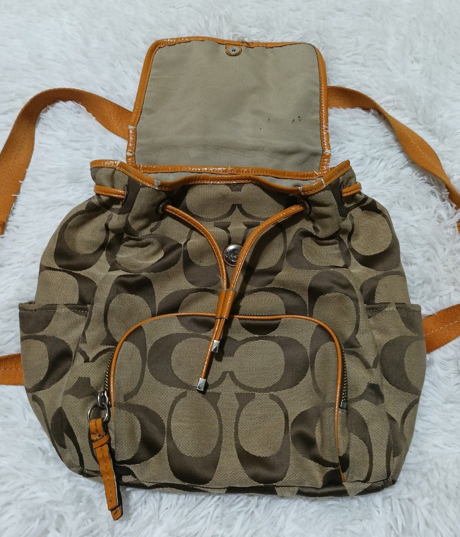 Coach Signature C Brown Orange Canvas Backpack (Category: Backpacks) located in Quezon City. Submitted by jdwoah12 (Listing ID 1470185235, Image 3). Description: - CONDITION: 8/10 EXCELLENT - ISSUE: SEND KOPO THRU PM.