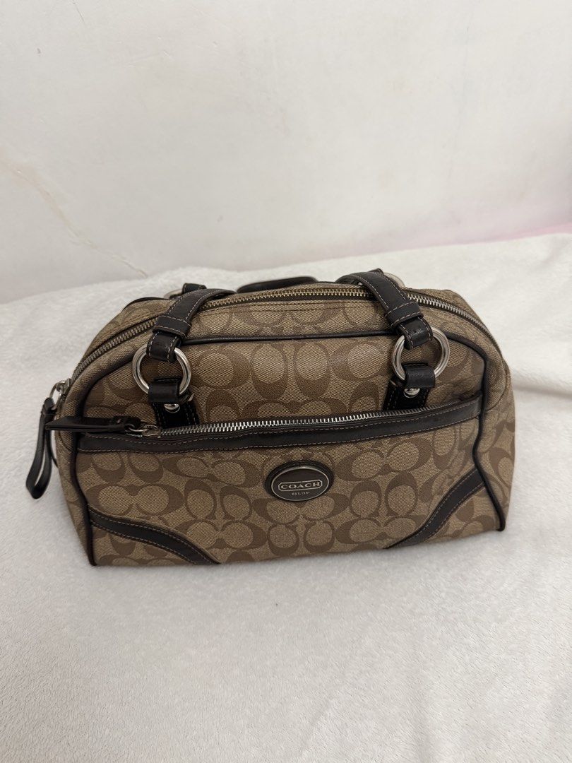 Coach Signature Satchel Handbag (Category: Luxury Bags & Wallets) located in Dasmarinas. Submitted by charoaso (Listing ID 1470173935, Image 2). Description: Coach Signature monogram shoulder bag - Color: Brown fabric with dark brown leather trim - Hardware: Silver-tone issue: lining rfs: for vet expense .