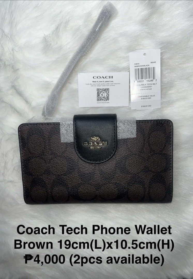 Coach Tech Phone Wallet Brown/Black (Category: Wallets & Card holders) located in Imus. Submitted by maria_pilayo (Listing ID 1470281656, Image 1). Description: - Brand: Coach - 💯% Authentic - Model: C2874 SIG CLRBLK TECH WLT - Colorway: Brown (Signature Colorblock) - Dimensions: 19cm (L) x 10.5cm (H) - Features: Multiple card slots and convenient wrist strap - Condition: Brand new in plastic packaging - Inclusions: Original tags and care card i
