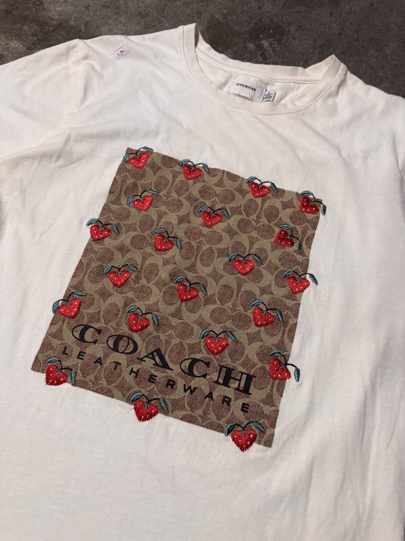 Coach white shirt (Category: Shirts) located in Pasig City. Submitted by dripthrift1600 (Listing ID 1470312664, Image 3). Description: - Coach White Shirt - Good condition - Issue: None - Sizes: M - Dimes: 19x24.