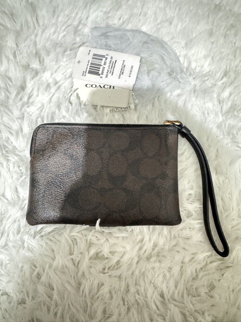 Coach Wrislet (Category: Luxury Bags & Wallets) located in Pasay City. Submitted by kiwimango03 (Listing ID 1470249927, Image 3). Description: Authentic Coach Brown/Black Wristlet Signature coated canvas What you see is what you get .