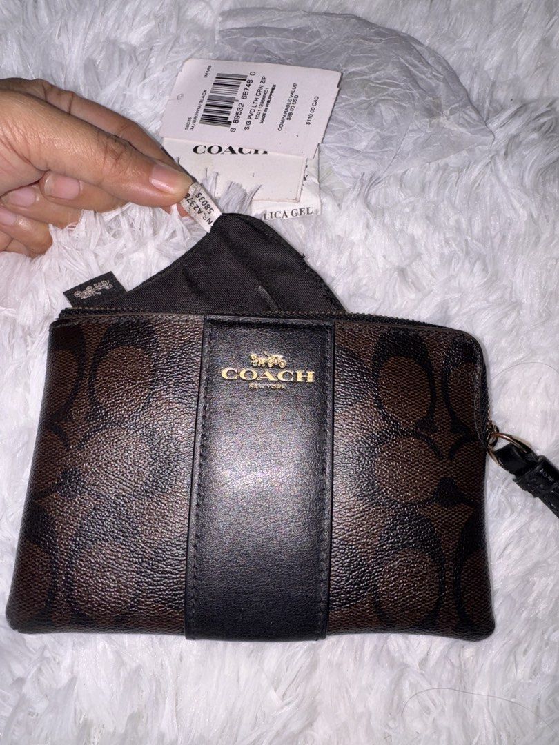Coach Wrislet (Category: Luxury Bags & Wallets) located in Pasay City. Submitted by kiwimango03 (Listing ID 1470249927, Image 2). Description: Authentic Coach Brown/Black Wristlet Signature coated canvas What you see is what you get .