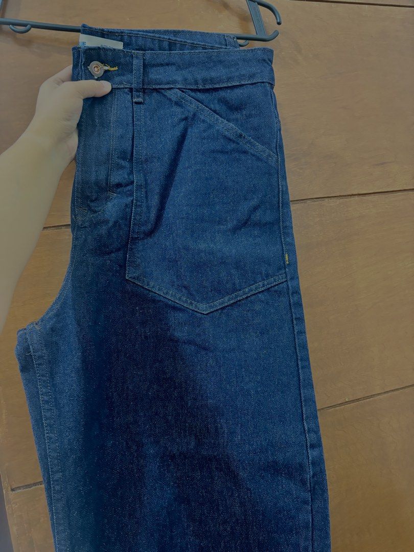 Code Blue Denimwear Dark Wash Jeans Size 34 (Category: Jeans) located in Muntinlupa City. Submitted by closetfinds_ph_952 (Listing ID 1470273837, Image 1). Description: -Brand: Code Blue from SM Dept Store -Barrel Pants for Men - Size: 34 waist - Wash: Dark indigo / dark wash denim - Details: Workwear style front and back patch pockets - Feature: Cinch back strap with metal buckle - Stitching: Contrasting yellow stitch details - Closure: Button f
