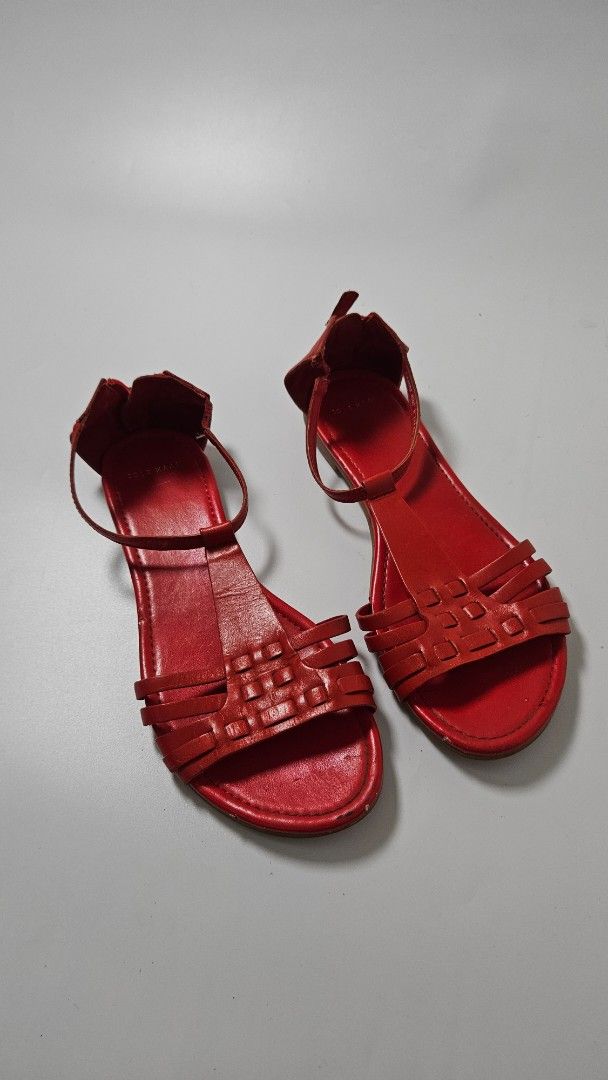 Cole Haan Red Leather Flat Sandals Size 6.5B (Category: Flats & Sandals) located in Alfonso. Submitted by jbcamet (Listing ID 1470267467, Image 1). Description: - Brand/Model: Cole Haan Leather Sandals - Color: Vibrant Red (Great for summer!) - Size: 6.5B - Material: Leather with woven strap design - Closure: Back heel zipper for easy wear - Origin: Made in India - Condition: Uppers are in clean shape; soles show light scuffing from previous wear