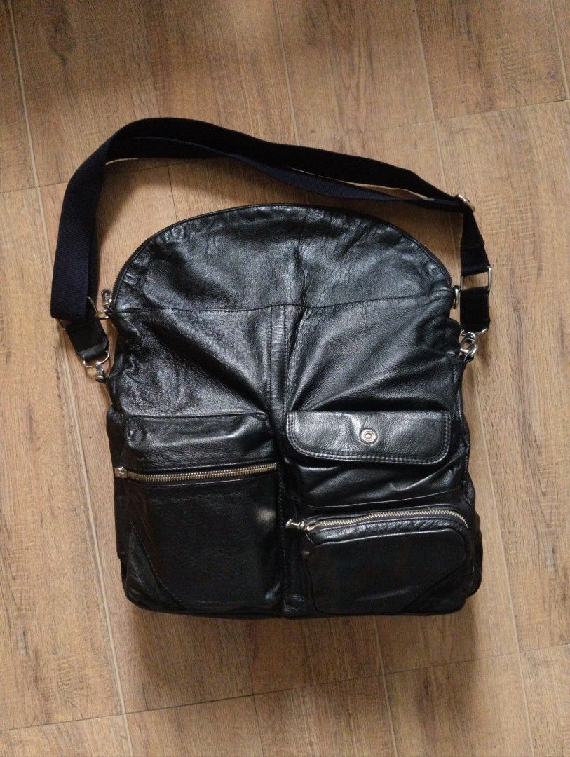 COMME CA MEN Leather Multi-Pocket Messenger Bag with Shoulder Strap (Category: Sling Bags) located in Quezon City. Submitted by rackreviva27782 (Listing ID 1470205136, Image 2). Description: COMME CA MEN LEATHER UTILITY MESSENGER BAG 2800 php +sf width 15 length 18 (9 folded) excellent condition qc loc - Color: Black - Material: Premium leather - Storage: Roomy main compartment, multiple front zip pockets, snap closure pouch, and interior zip poc
