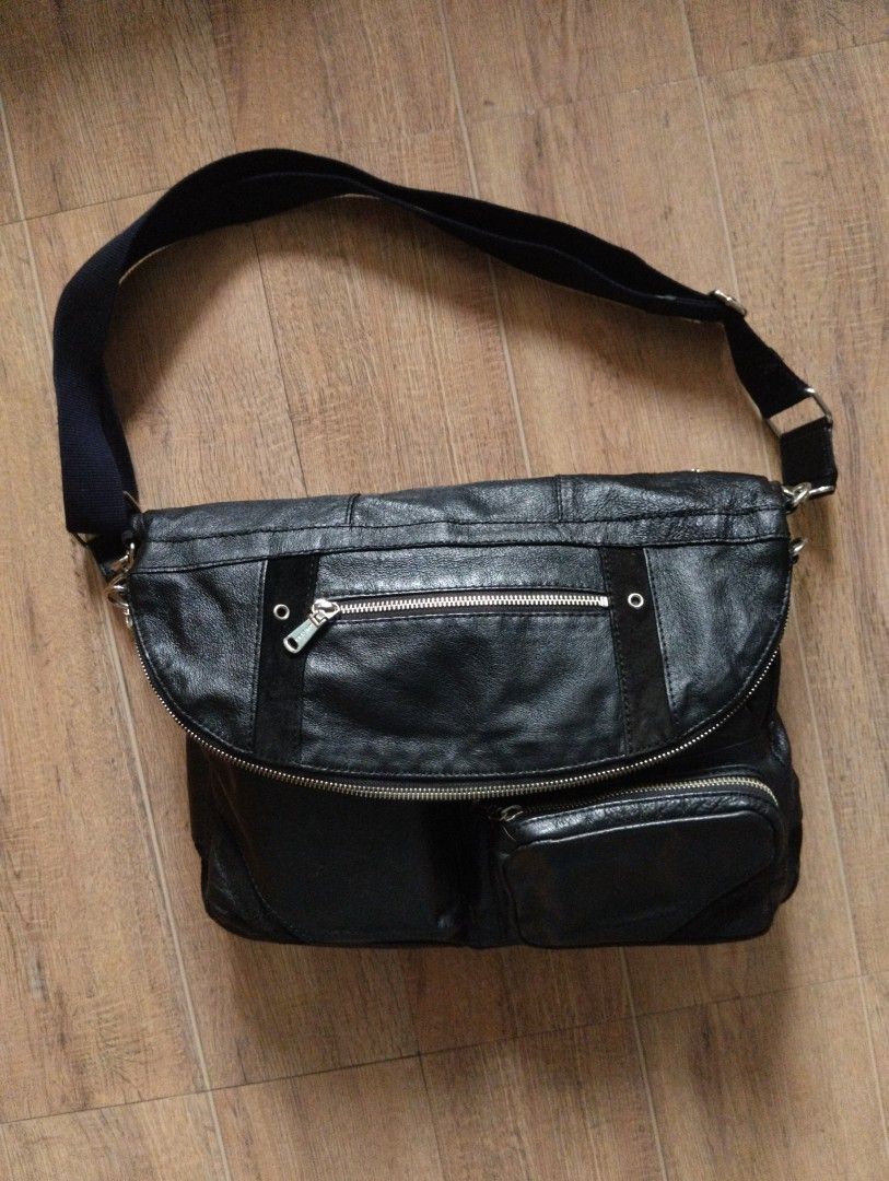 COMME CA MEN Leather Multi-Pocket Messenger Bag with Shoulder Strap (Category: Sling Bags) located in Quezon City. Submitted by rackreviva27782 (Listing ID 1470205136, Image 1). Description: COMME CA MEN LEATHER UTILITY MESSENGER BAG 2800 php +sf width 15 length 18 (9 folded) excellent condition qc loc - Color: Black - Material: Premium leather - Storage: Roomy main compartment, multiple front zip pockets, snap closure pouch, and interior zip poc