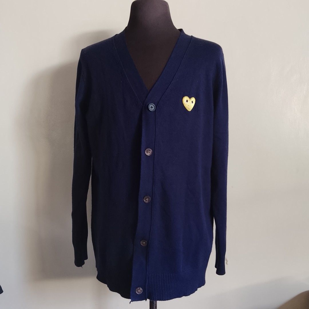 Comme Des Garcons - Navy Blue Cardigan (Category: Luxury Apparel) located in Angeles City. Submitted by sselects_ (Listing ID 1470159662, Image 1). Description: Details of the item: *Color may vary due to lighting Size: L on tag, fits L-XL imo Width: 21" Length: 28" Sleeves: 25" Issue: 1st button got replaced, button conditions sign of usage Condition: Good ALL ITEMS ARE NEGOTIABLE.