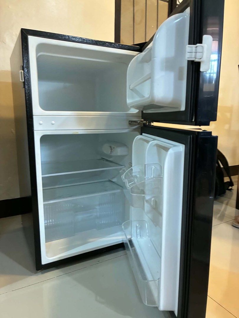 Condura Two Door Refrigerator Black (Category: Refrigerators and Freezers) located in Quezon City. Submitted by krengkreng (Listing ID 1470170485, Image 1). Description: - Brand/Model: Condura two-door refrigerator in sleek black - Condition: Good working order, keeps items cold with no issues; normal signs of use on the exterior - Size: Compact design, ideal for small spaces like condo units, dorms, or apartments - Interior: Very clean, includes