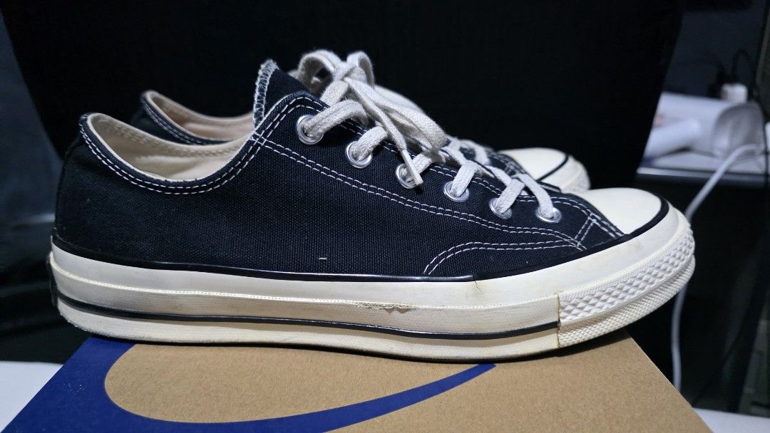 Converse Chuck 70 Low Black (Category: Casual Shoes) located in Caloocan City. Submitted by evsrs79033 (Listing ID 1470199348, Image 3). Description: - Brand: Converse - Model: Chuck 70 Low - size 8UK mens - Color: Black canvas with cream rubber midsoles and white laces - Details: Classic heel patches, black piping - Condition: 8/10 minor flaws such as sole sep, slight drags and left insole discoloration - Inclusions: Comes with original box.