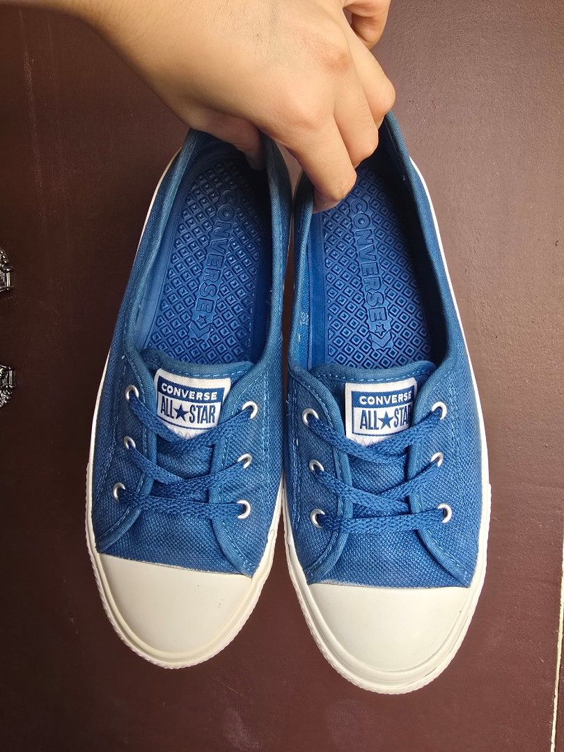 Converse Chuck Taylor All Star Ballet (Category: Sneakers) located in Makati City. Submitted by gentletree.4b536a (Listing ID 1470175459, Image 1). Description: - Brand: Converse - Style: Blue canvas slip-on sneakers - Size: US Women's 7 / EUR 38 / UK 5 - Features: White rubber toe caps, texturized blue insoles with Converse branding, and white heel patches with the All Star logo - Condition: Clean soles, minimal wear visible - Perfect for daily 