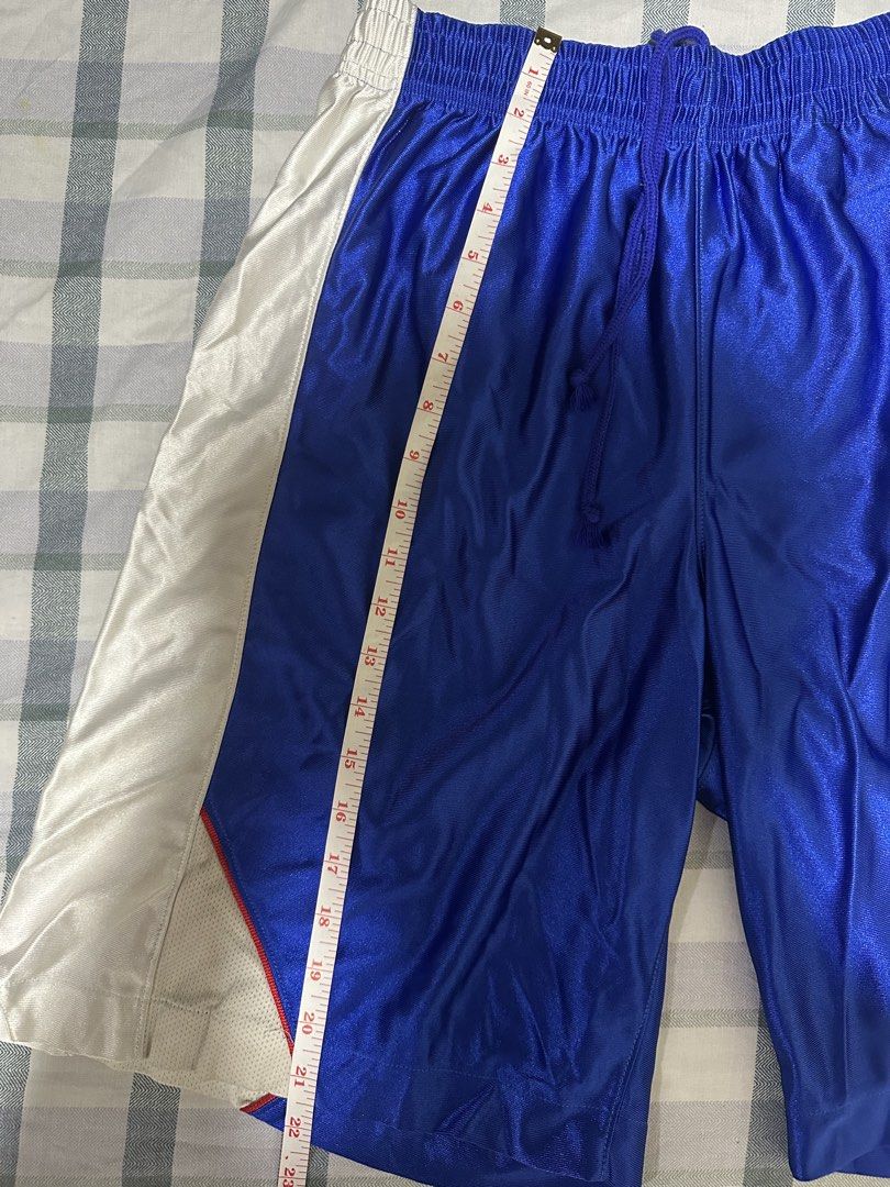 Converse Competition Blue White Basketball Shorts (Category: Shorts) located in Manila. Submitted by shoriljane (Listing ID 1470288711, Image 3). Description: - Brand: Converse Competition - Style Code: CB2380 - Color: Royal blue with white side panels and drawstrings - Size: Men's O JASPO - Features: Elastic waist with working drawstring, mesh inserts near the hem, and printed Converse star logo on the left leg - Condition: Clean fabric with bri