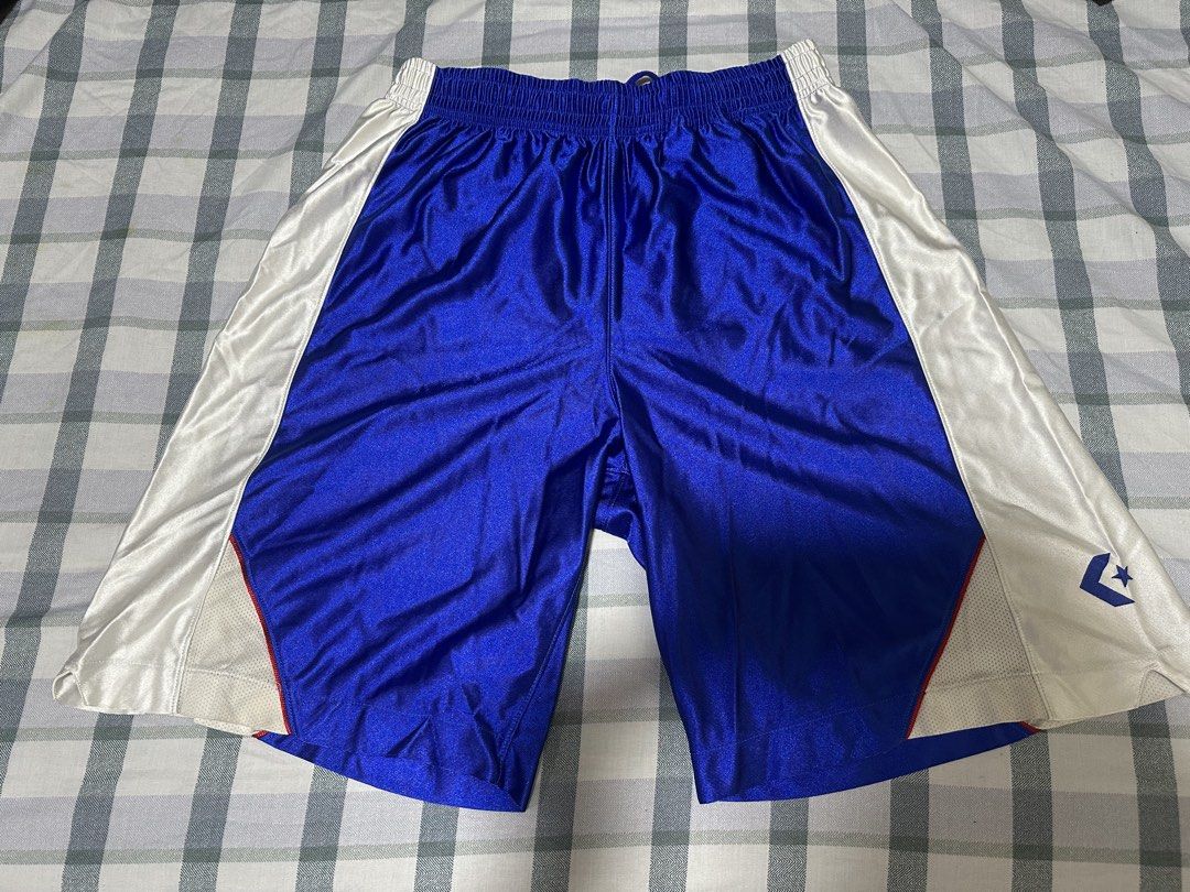 Converse Competition Blue White Basketball Shorts (Category: Shorts) located in Manila. Submitted by shoriljane (Listing ID 1470288711, Image 1). Description: - Brand: Converse Competition - Style Code: CB2380 - Color: Royal blue with white side panels and drawstrings - Size: Men's O JASPO - Features: Elastic waist with working drawstring, mesh inserts near the hem, and printed Converse star logo on the left leg - Condition: Clean fabric with bri