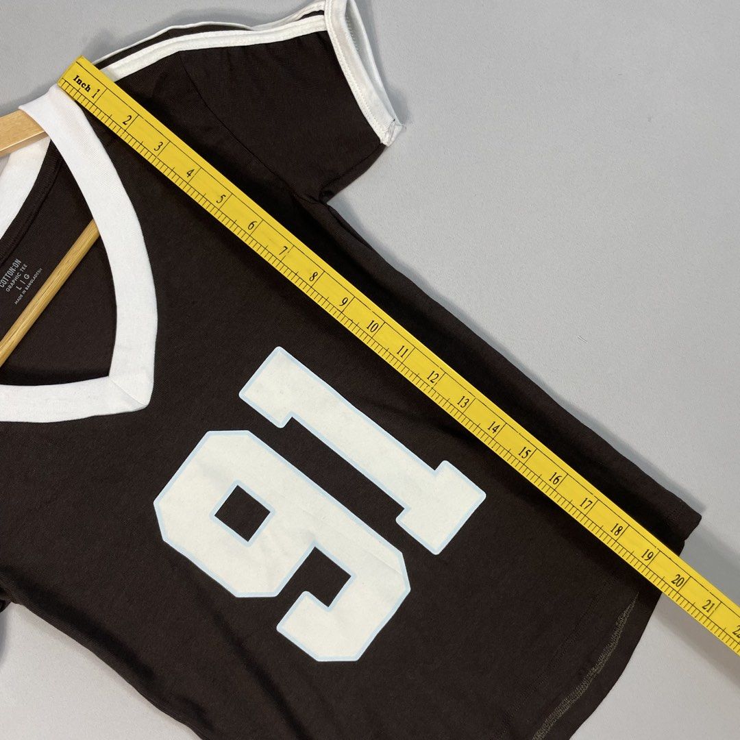 COTTON ON | Graphic Dark Brown 91 V-Neck Ringer Tee (Category: Shirts) located in Norzagaray. Submitted by sevenjscloset (Listing ID 1470283191, Image 3). Description: - Brand: Cotton On - Available: 3 Pieces - Sizes: Small, Large, XL •Small - (Length: 18 inches | Width: 12 inches) •Large - (Length: 20 inches | Width: 13 inches) •XL - (Length: 20.5 inches | Width: 13.5 inches) - Model Reference: 5’2” height , 50kg weight - Style: Dark brown v-nec