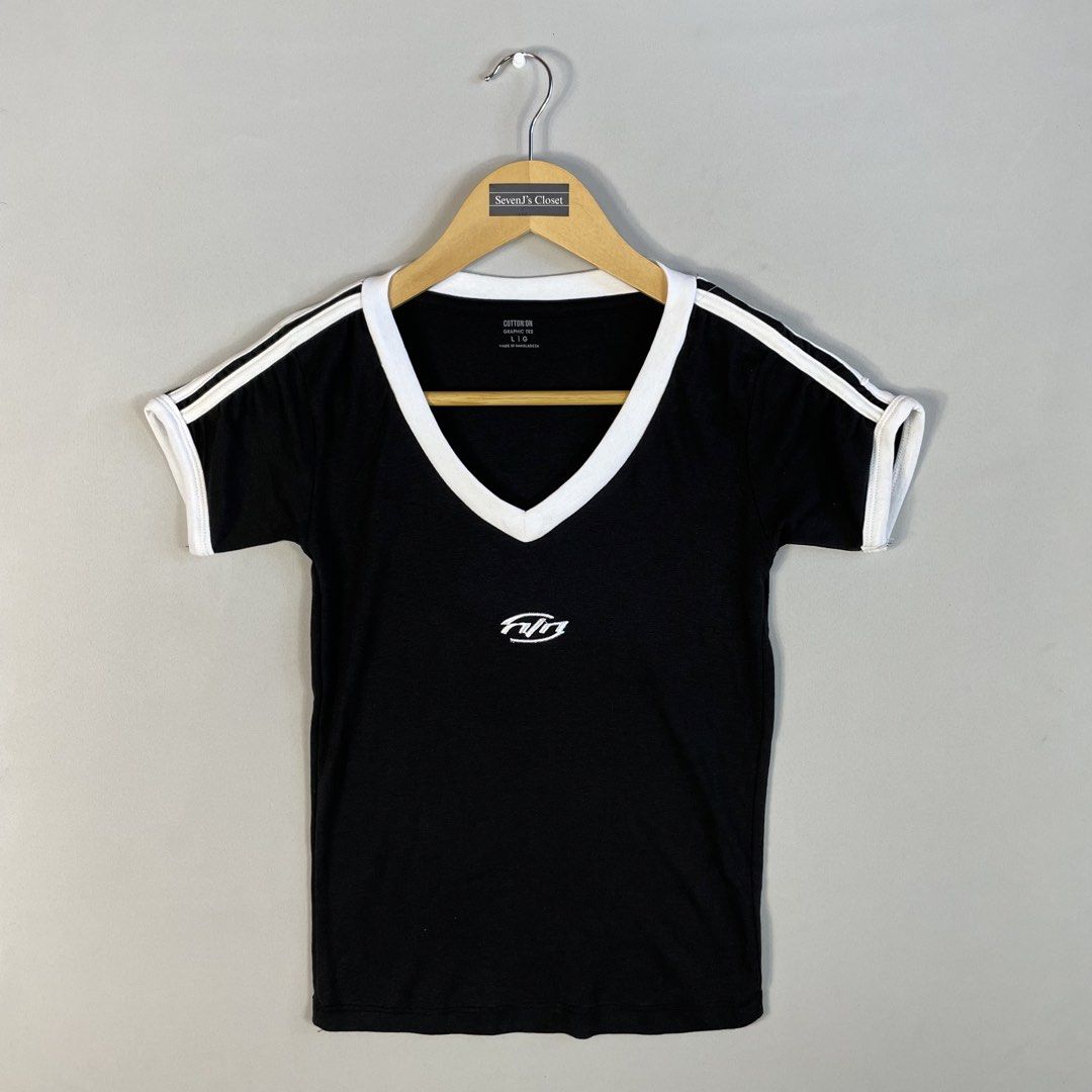 COTTON ON | Minimalist Black V-Neck Ringer Tee (Category: Shirts) located in Norzagaray. Submitted by sevenjscloset (Listing ID 1470280014, Image 1). Description: - Brand: Cotton On - Style: Minimalist black v-neck ringer tee with white contrast trim - Details: Embroidered graphic branding on the chest - Size: Tagged Large (Length: 20 inches, Width: 13 inches) - Model Reference: 5’2” height , 50kg weight.
