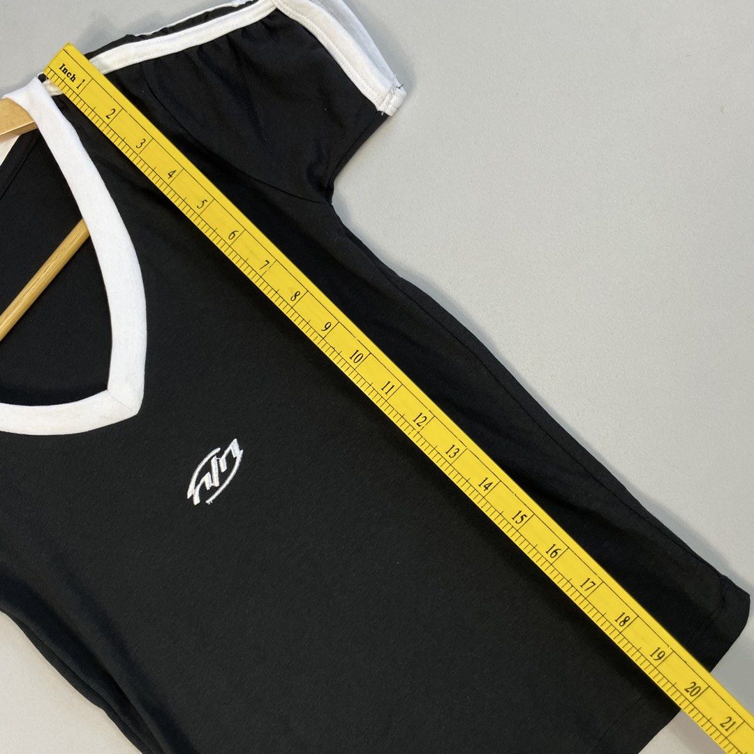COTTON ON | Minimalist Black V-Neck Ringer Tee (Category: Shirts) located in Norzagaray. Submitted by sevenjscloset (Listing ID 1470280014, Image 3). Description: - Brand: Cotton On - Style: Minimalist black v-neck ringer tee with white contrast trim - Details: Embroidered graphic branding on the chest - Size: Tagged Large (Length: 20 inches, Width: 13 inches) - Model Reference: 5’2” height , 50kg weight.