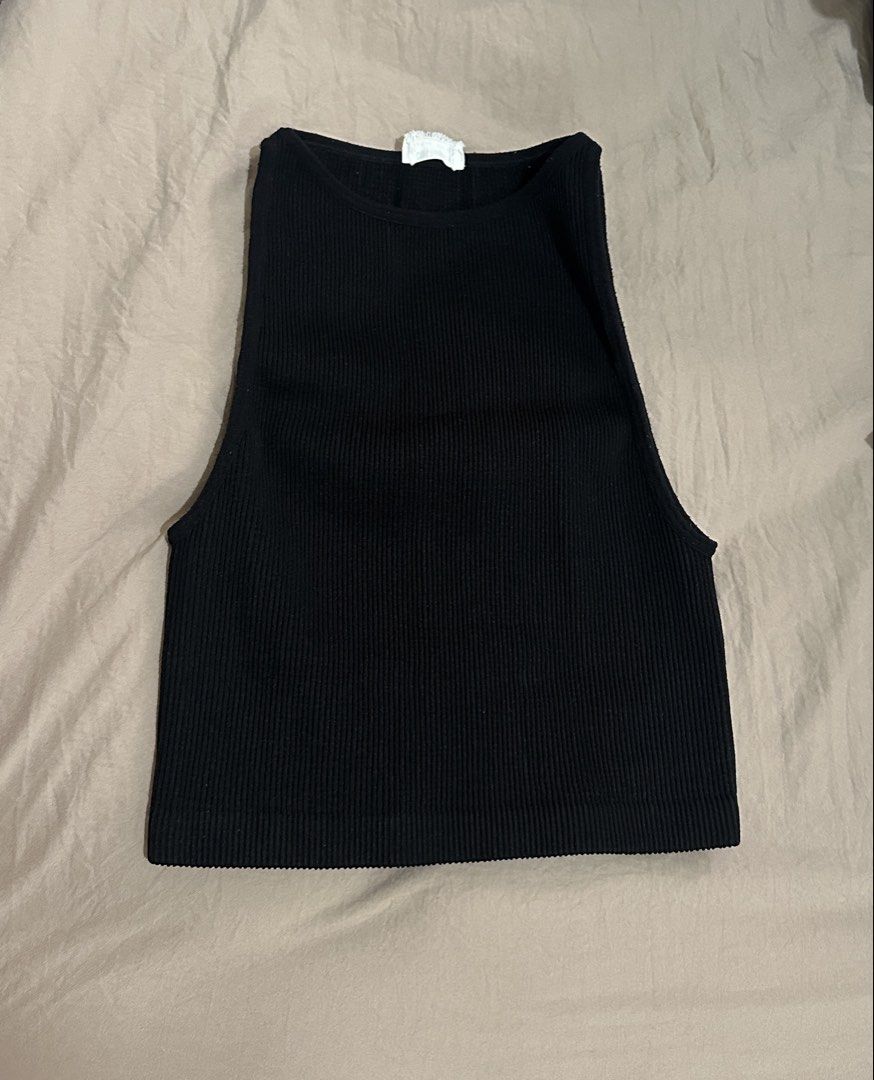 Cotton On Ribbed Tank Top Bundle (Category: Sleeveless) located in Manila. Submitted by rf0415 (Listing ID 1470165994, Image 1). Description: - Brand: Cotton On - Set of 2: Black and Brown - Size: XS/S - Fit: Snug, stretchy fabric with a high neckline and sleeveless cut - Style: Essential basics, perfect for everyday layering.