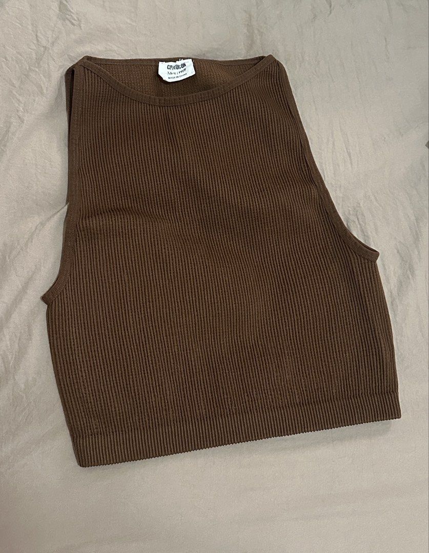 Cotton On Ribbed Tank Top Bundle (Category: Sleeveless) located in Manila. Submitted by rf0415 (Listing ID 1470165994, Image 2). Description: - Brand: Cotton On - Set of 2: Black and Brown - Size: XS/S - Fit: Snug, stretchy fabric with a high neckline and sleeveless cut - Style: Essential basics, perfect for everyday layering.