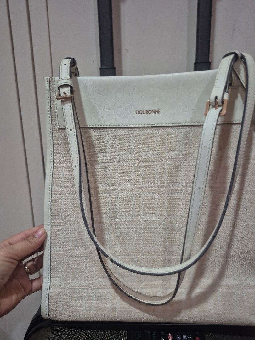 Couronne Beige Monogram Tote Shoulder Bag (Category: Luxury Bags & Wallets) located in Iloilo. Submitted by gorgeoustatz (Listing ID 1470288597, Image 1). Description: - Brand/Model: Couronne Tote Bag - Color/Material: Cream & beige monogram jacquard with light leather side panels - Hardware: Gold-tone branding - Straps: Dual adjustable shoulder straps with buckle details - Interior: Roomy and spacious for daily essentials - Condition: Clean fabr