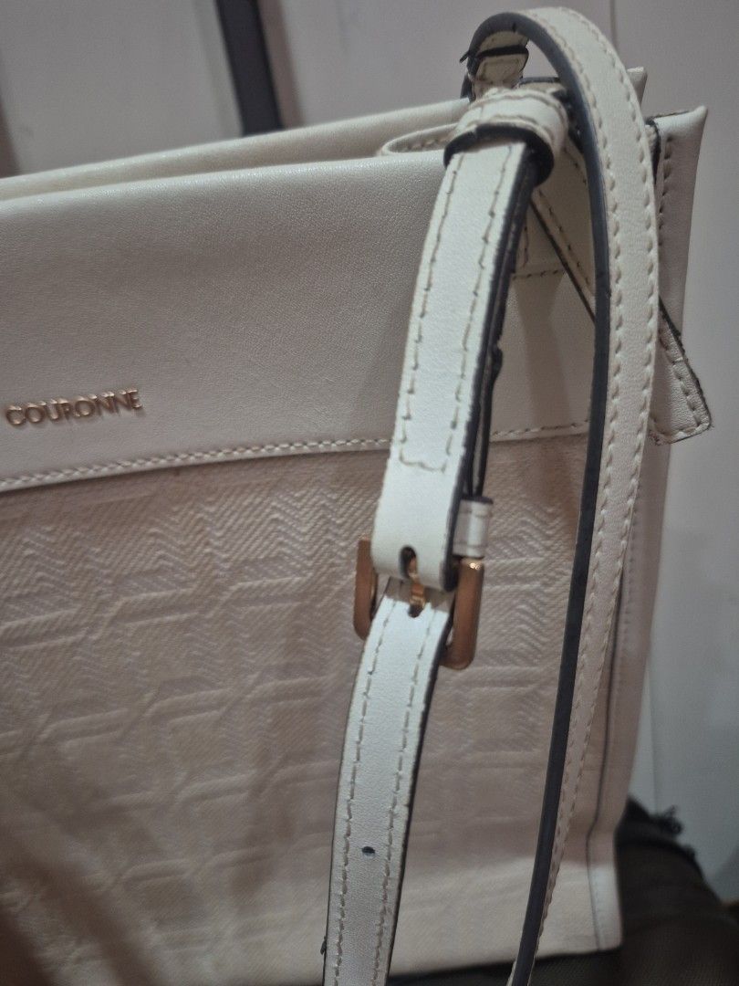 Couronne Beige Monogram Tote Shoulder Bag (Category: Luxury Bags & Wallets) located in Iloilo. Submitted by gorgeoustatz (Listing ID 1470288597, Image 3). Description: - Brand/Model: Couronne Tote Bag - Color/Material: Cream & beige monogram jacquard with light leather side panels - Hardware: Gold-tone branding - Straps: Dual adjustable shoulder straps with buckle details - Interior: Roomy and spacious for daily essentials - Condition: Clean fabr